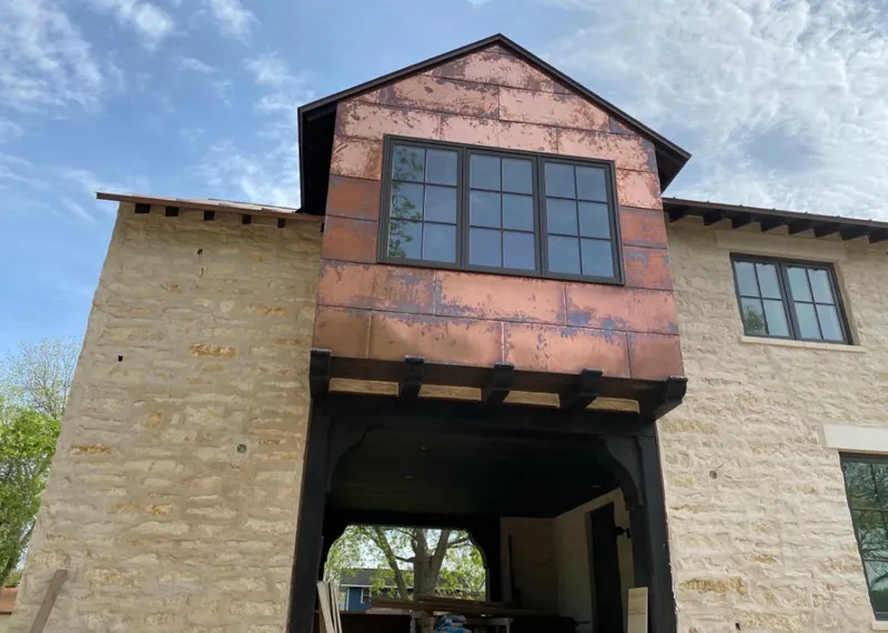 Copper metal panel facade on a stone building for Metal Roof Coating in Canal Fulton